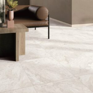 Dreamy Cream marble-look porcelain floor tiles installed in a modern living room with warm neutral furnishings