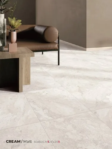 Dreamy Cream marble-look porcelain floor tiles installed in a modern living room with warm neutral furnishings