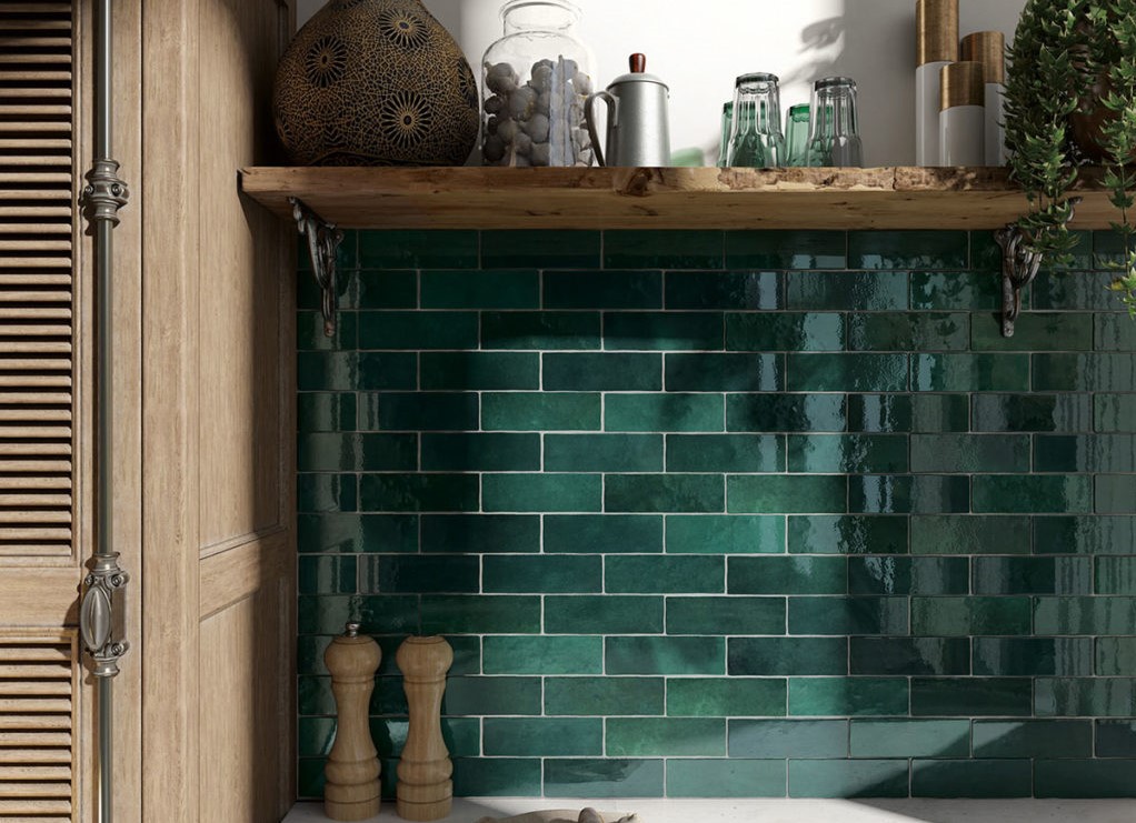 Artisan Moss Green gloss ceramic wall tile 65x200mm with handmade appearance and deep green V4 colour variation installed in a contemporary bathroom.