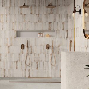 Magnetism White metallic-look matt ceramic wall tile 63x250mm installed as a contemporary feature wall with subtle metallic variation.