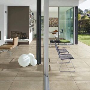 Bella Travertine Beige porcelain tile with realistic cross-cut travertine look in an outdoor patio setting.