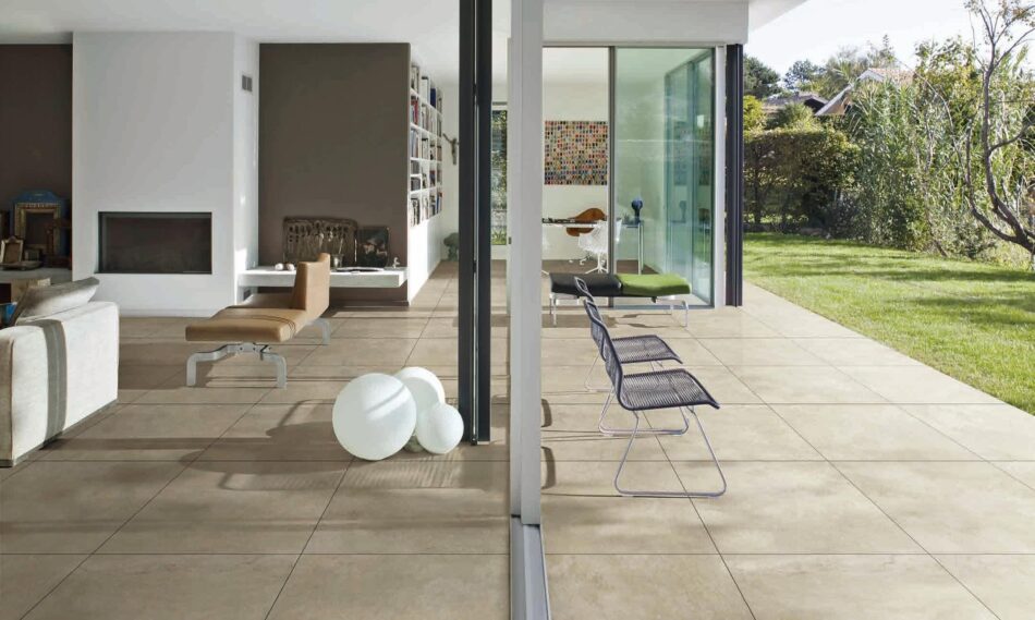 Bella Travertine Beige porcelain tile with realistic cross-cut travertine look in an outdoor patio setting.
